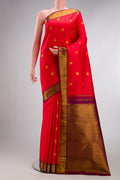 Pure Silk Red Kanjivaram Saree with Zari Butta on the body and Zari Border.  displayed on a mannequin