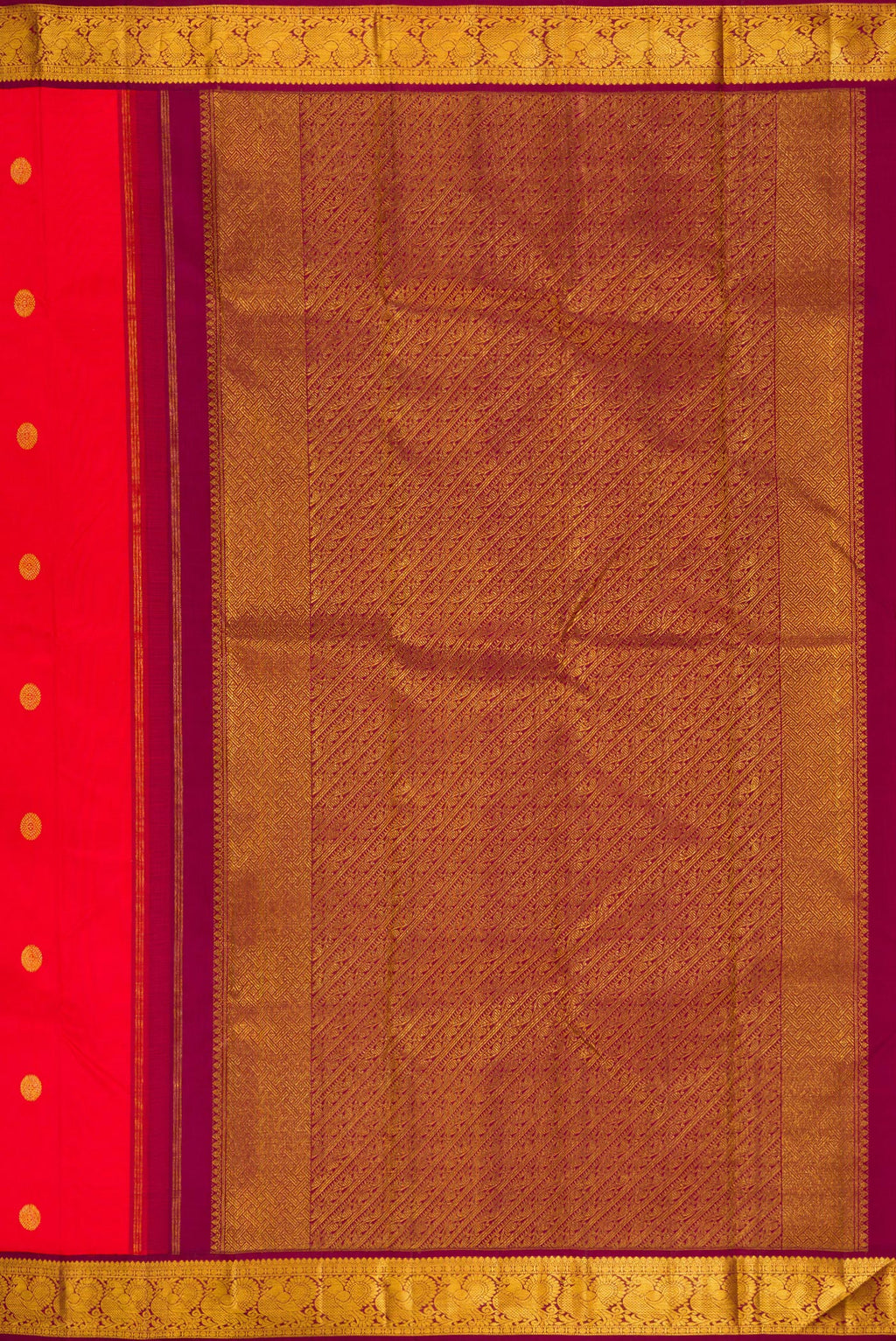 Close up image of the pallu of Pure Silk Red Kanjivaram Saree with Zari Butta on the body and Zari Border. 