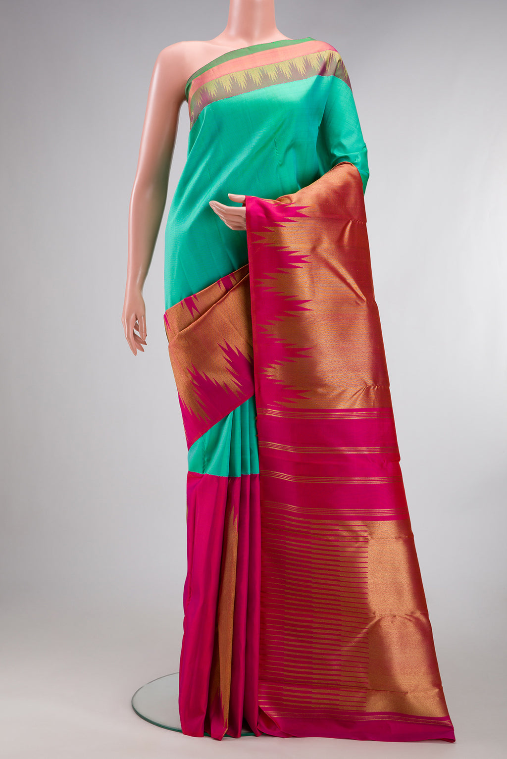 Pure Silk Pure Zari Sea Green Dual Tone Kanjivaram Saree with Half And Half on the body and Zari And Thread Border.  displayed on a mannequin