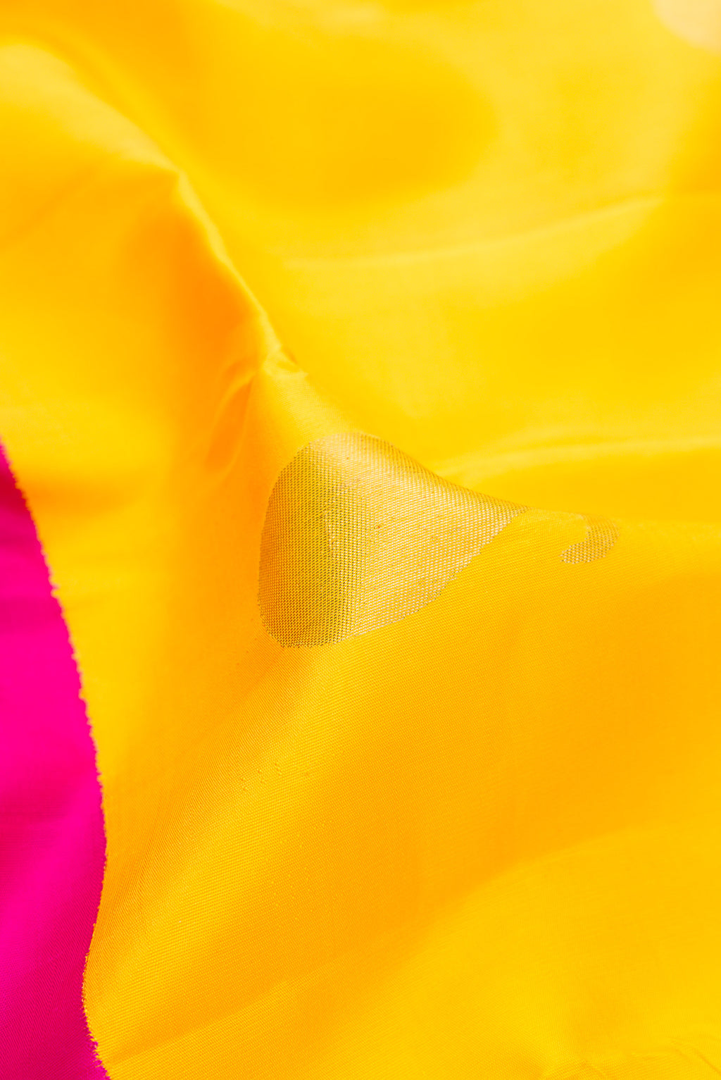 Close up of Pure Silk Pure Zari Yellow Kanjivaram Saree with Half And Half on the body and Zari Border.  displaying folds