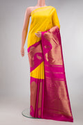 Pure Silk Pure Zari Yellow Kanjivaram Saree with Half And Half on the body and Zari Border.  displayed on a mannequin