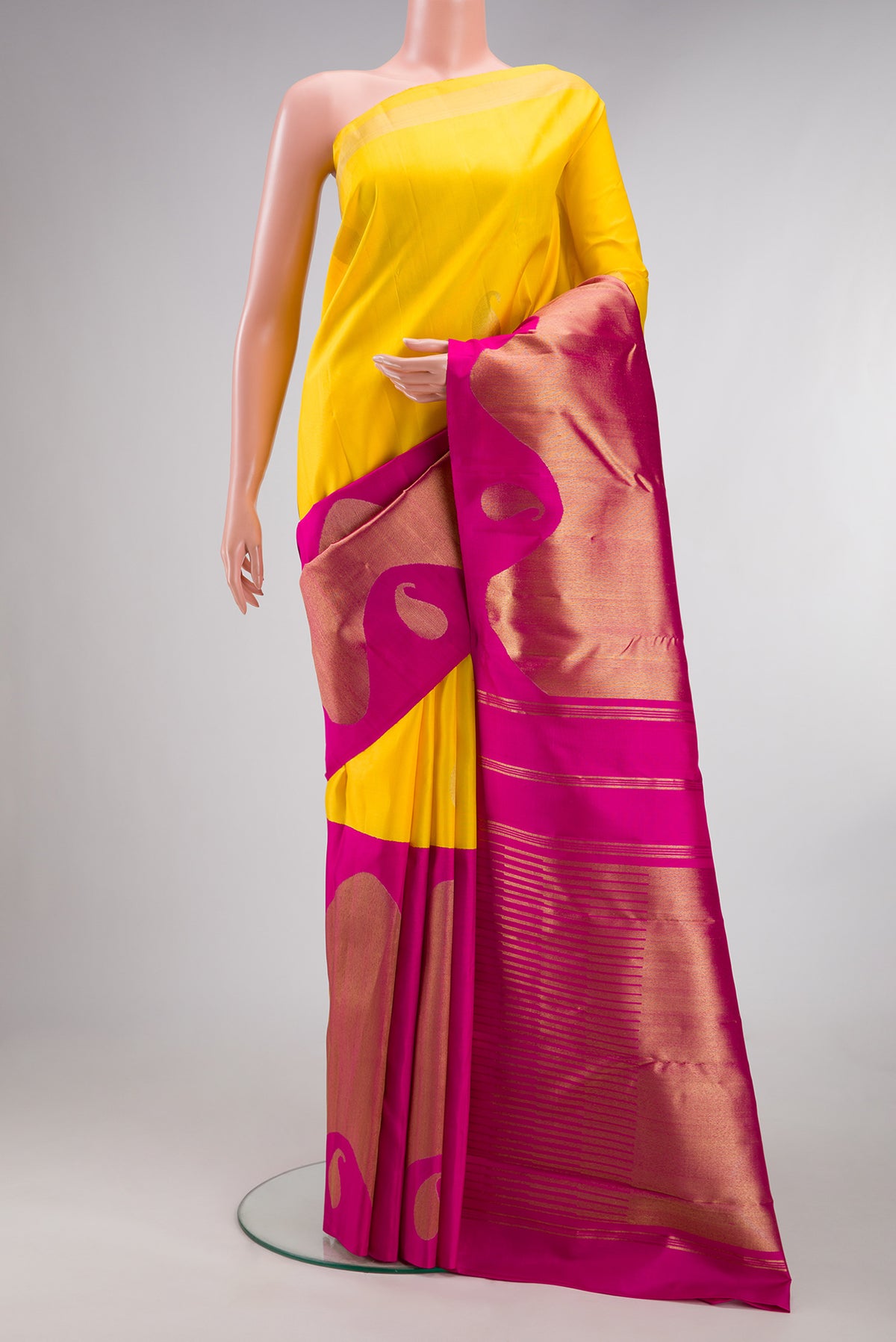 Pure Silk Pure Zari Yellow Kanjivaram Saree with Half And Half on the body and Zari Border.  displayed on a mannequin