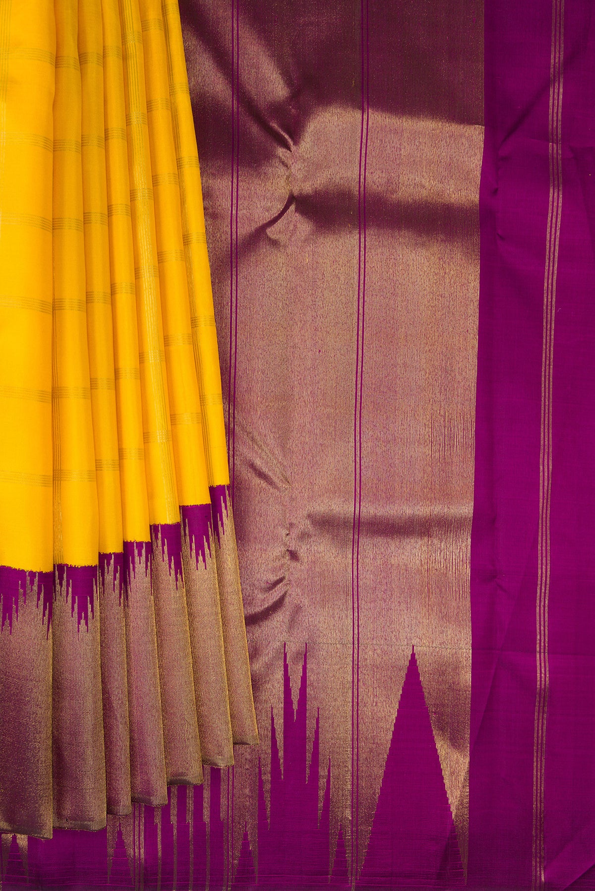 Pleats and pallu of Pure Silk Pure Zari Yellow Kanjivaram Saree with Checked design on the body and Temple Border. 