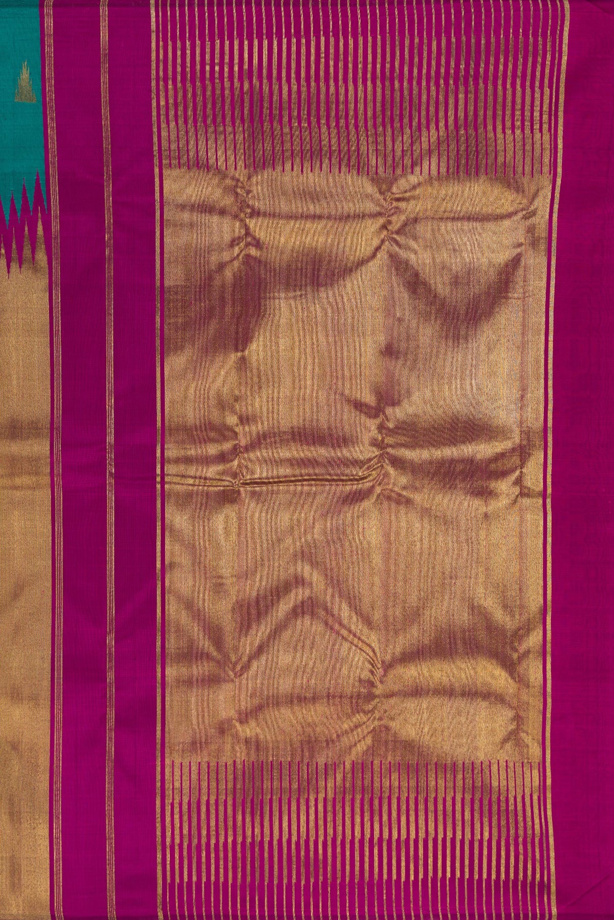Close up image of the pallu of Pure Silk Pure Zari Teal Kanjivaram Saree with Zari Butta on the body and Rising Temple Border. 