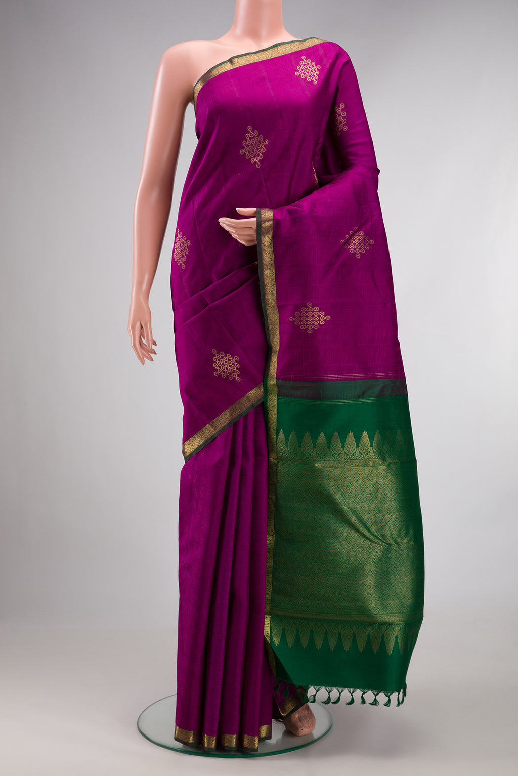Pure Silk Magenta Kanjivaram Saree with Jacquard With Zari Butta on the body and Zari Border.  displayed on a mannequin