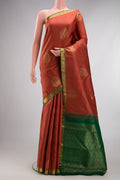 Pure Silk Rust Kanjivaram Saree with Jacquard With Zari Butta on the body and Zari Border.  displayed on a mannequin