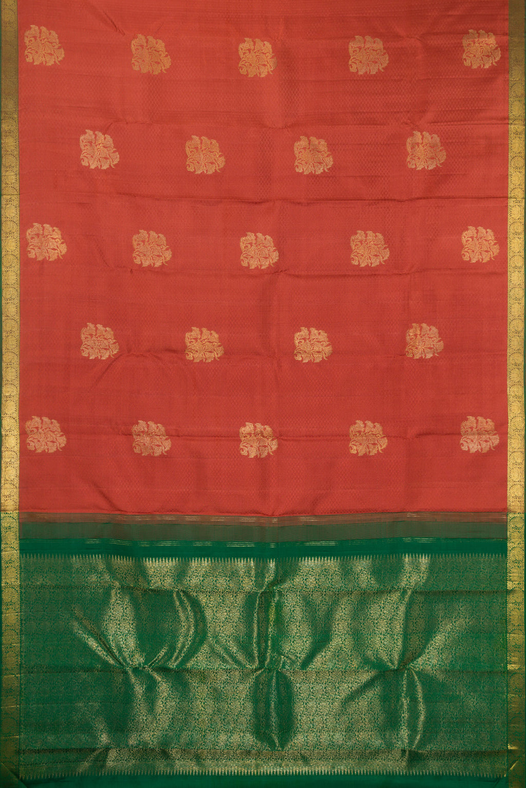 Flat view of Pure Silk Rust Kanjivaram Saree with Jacquard With Zari Butta on the body and Zari Border. 