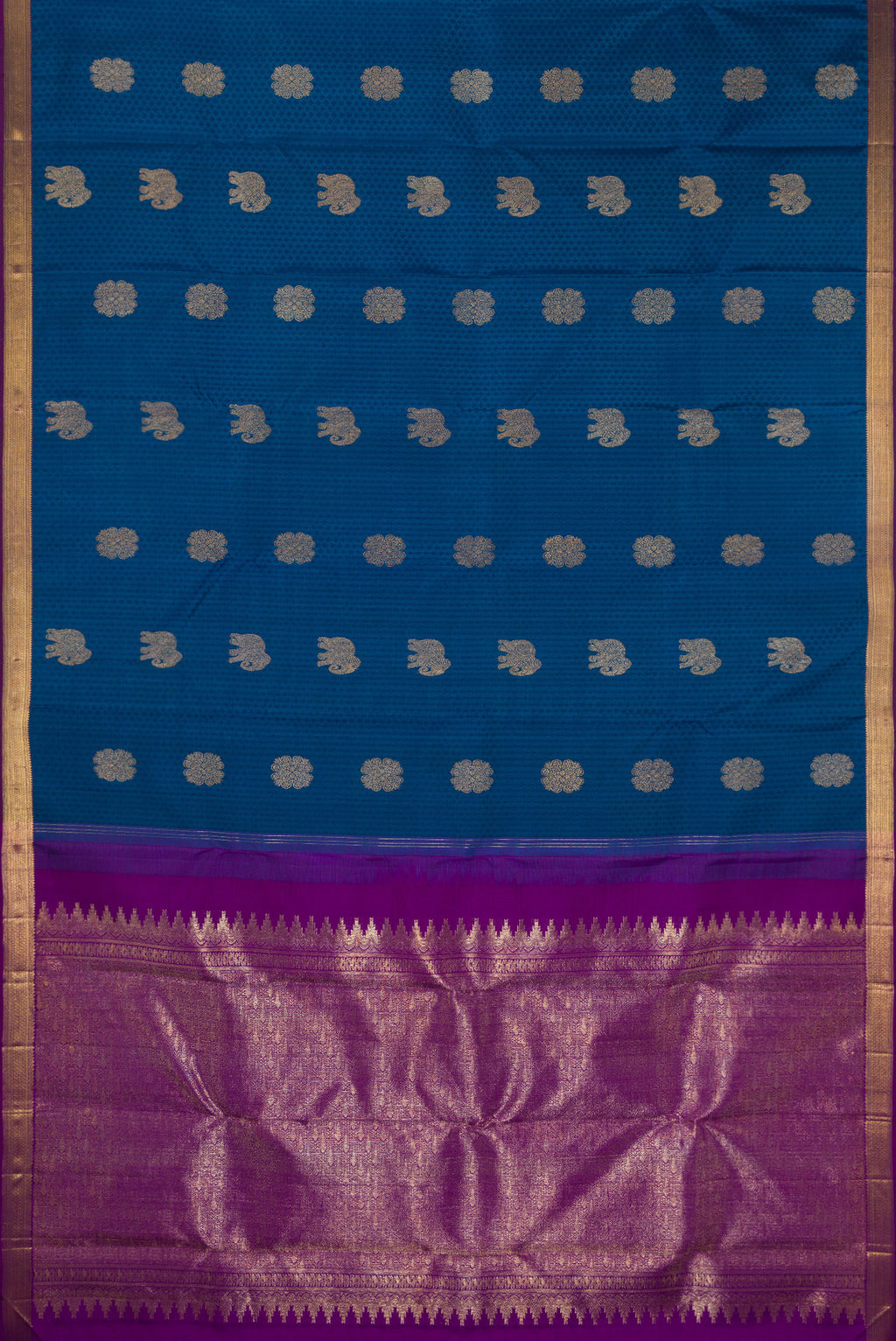 Flat view of Pure Silk Peacock Blue Kanjivaram Saree with Jacquard With Zari Butta on the body and Zari Border. 