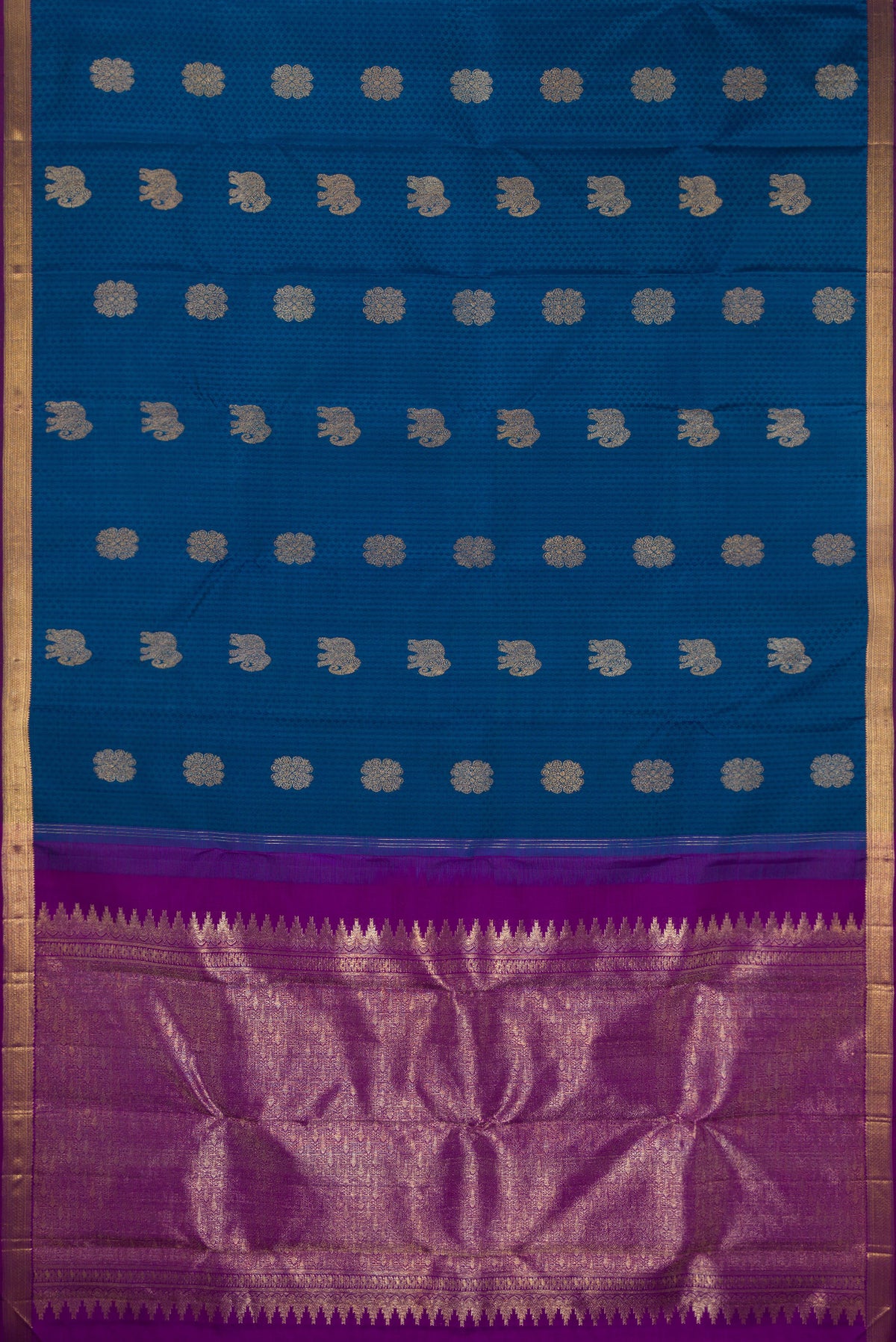 Flat view of Pure Silk Peacock Blue Kanjivaram Saree with Jacquard With Zari Butta on the body and Zari Border. 