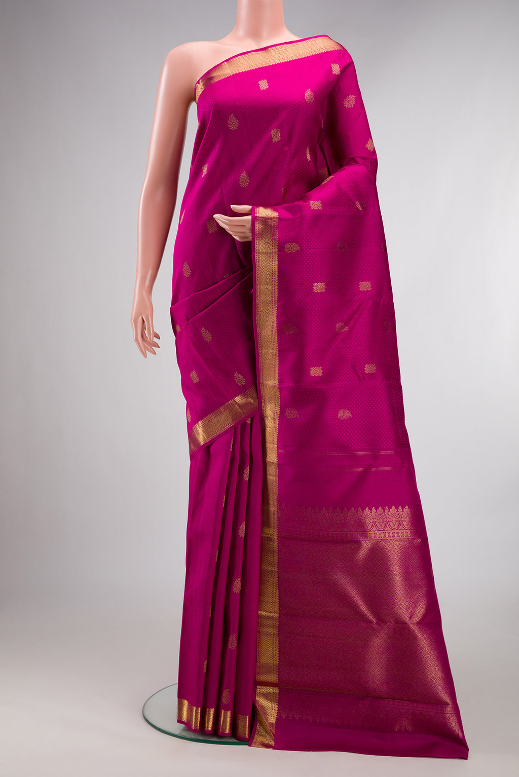 Pure Silk Pink Kanjivaram Saree with Jacquard With Zari Butta on the body and Zari Border.  displayed on a mannequin