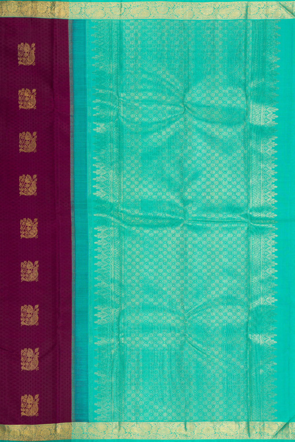 Close up image of the pallu of Pure Silk Maroon Kanjivaram Saree with Jacquard With Zari Butta on the body and Zari Border. 