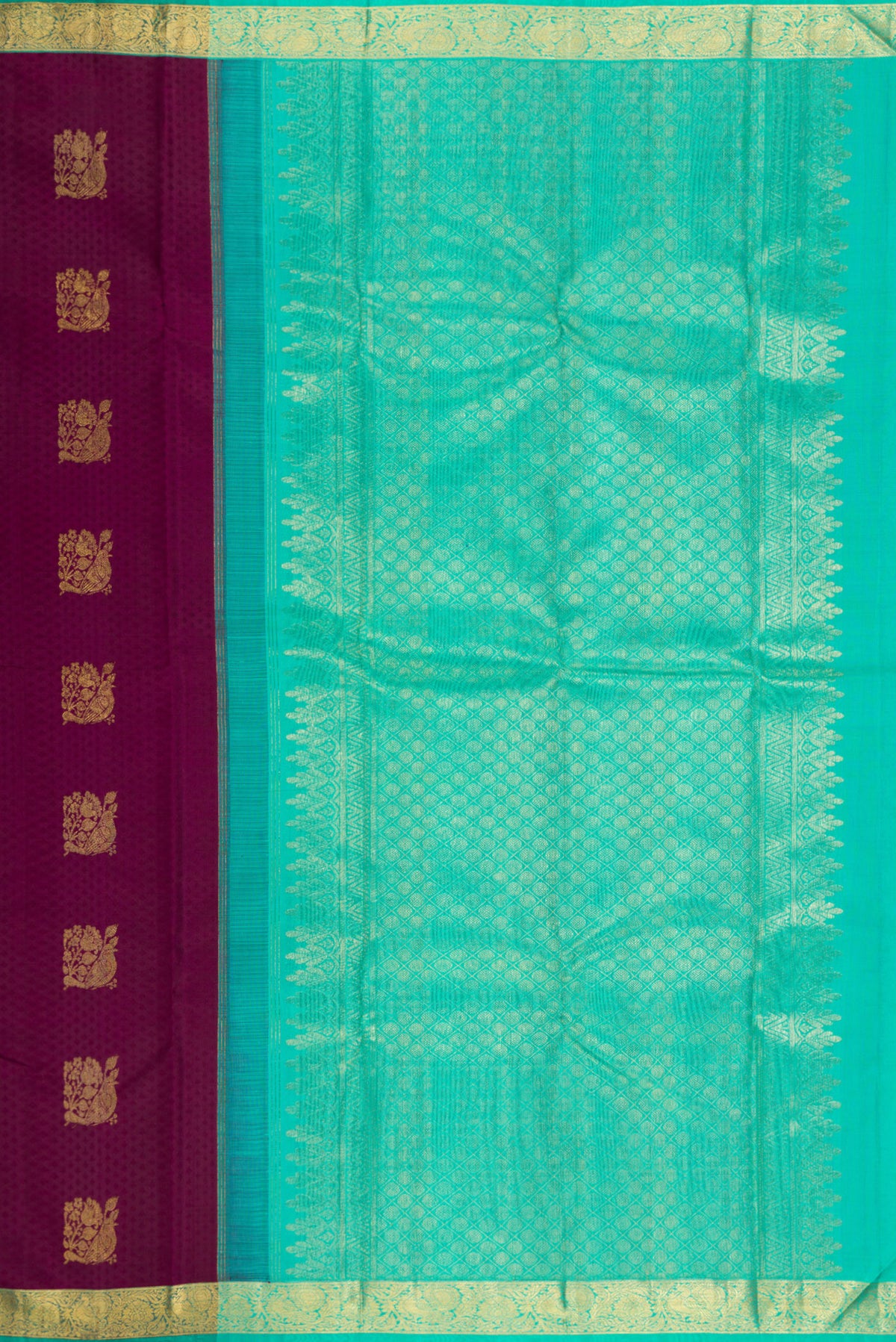 Close up image of the pallu of Pure Silk Maroon Kanjivaram Saree with Jacquard With Zari Butta on the body and Zari Border. 
