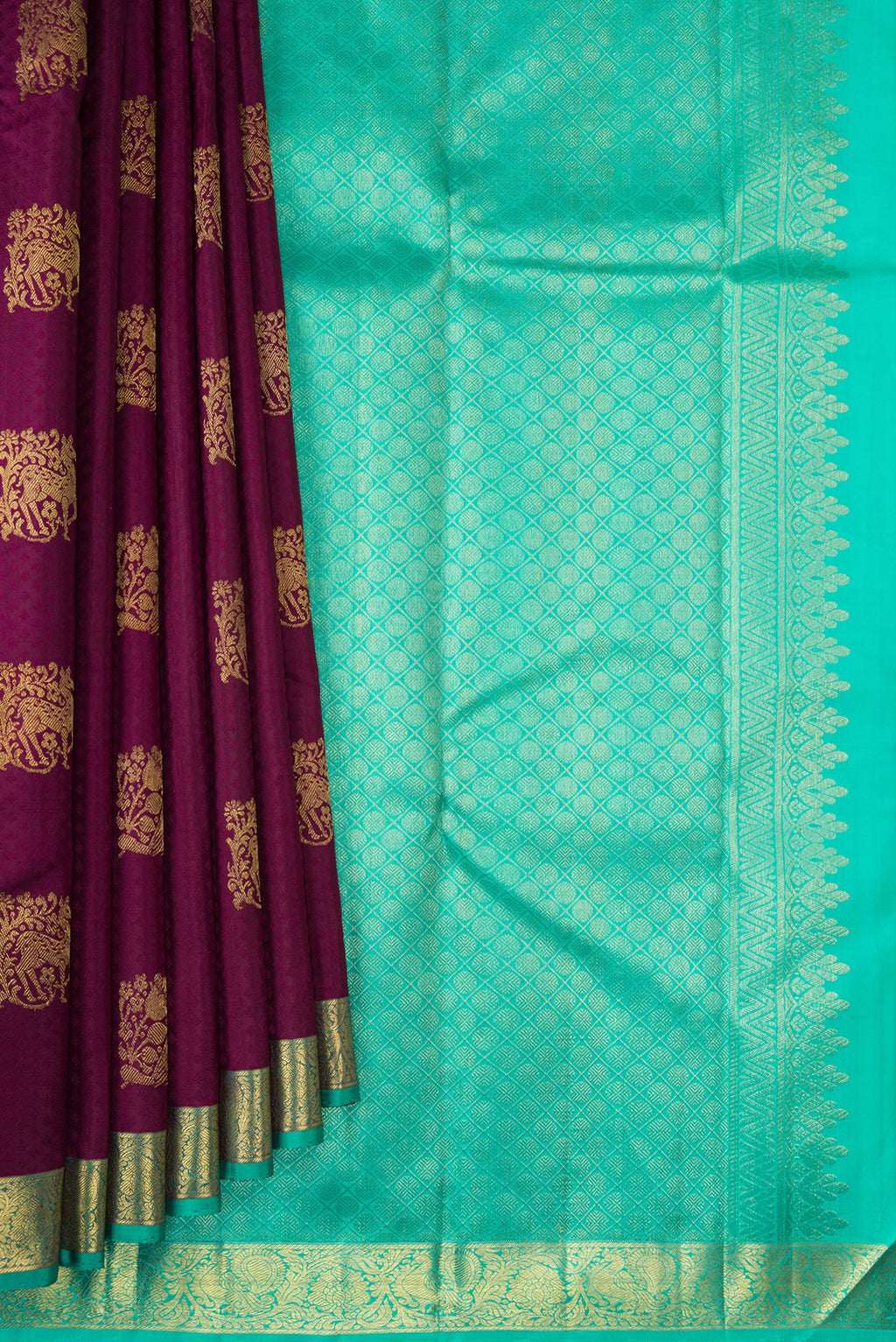 Pleats and pallu of Pure Silk Maroon Kanjivaram Saree with Jacquard With Zari Butta on the body and Zari Border. 