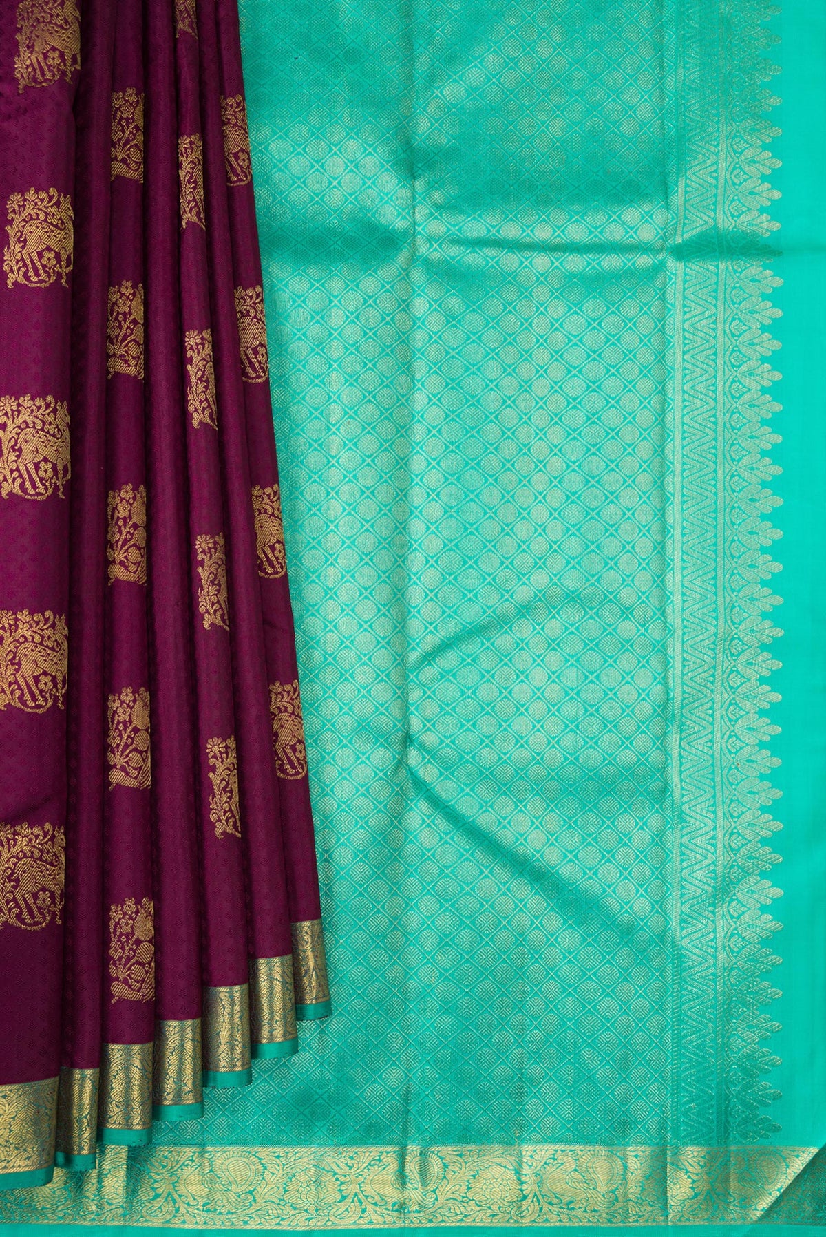 Pleats and pallu of Pure Silk Maroon Kanjivaram Saree with Jacquard With Zari Butta on the body and Zari Border. 