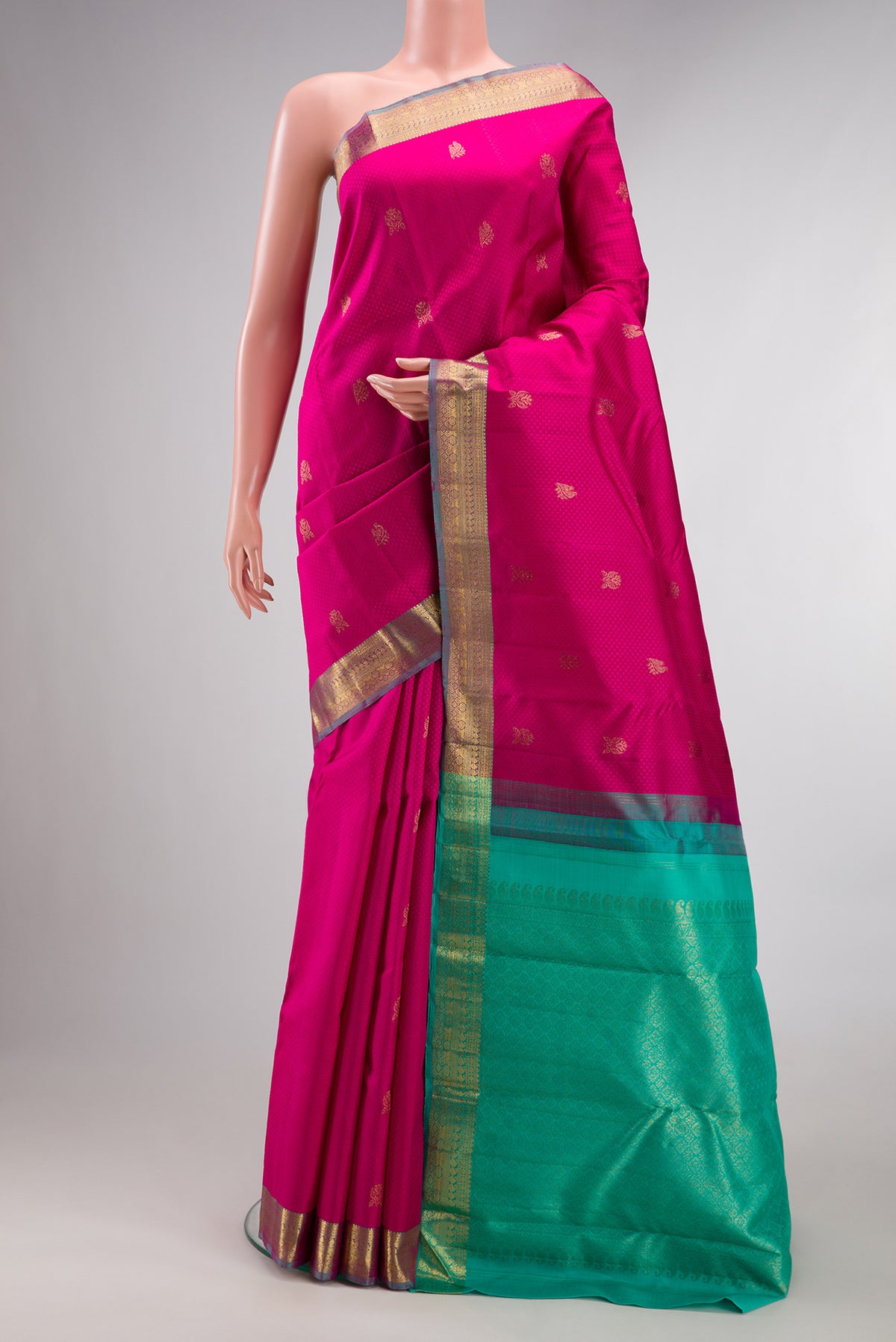 Pure Silk Pink Kanchipuram Saree with Jacquard With Zari Butta on the body and Zari Border.  displayed on a mannequin