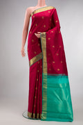 Pure Silk Deep Red Kanchipuram Saree with Jacquard With Zari Butta on the body and Zari Border.  displayed on a mannequin