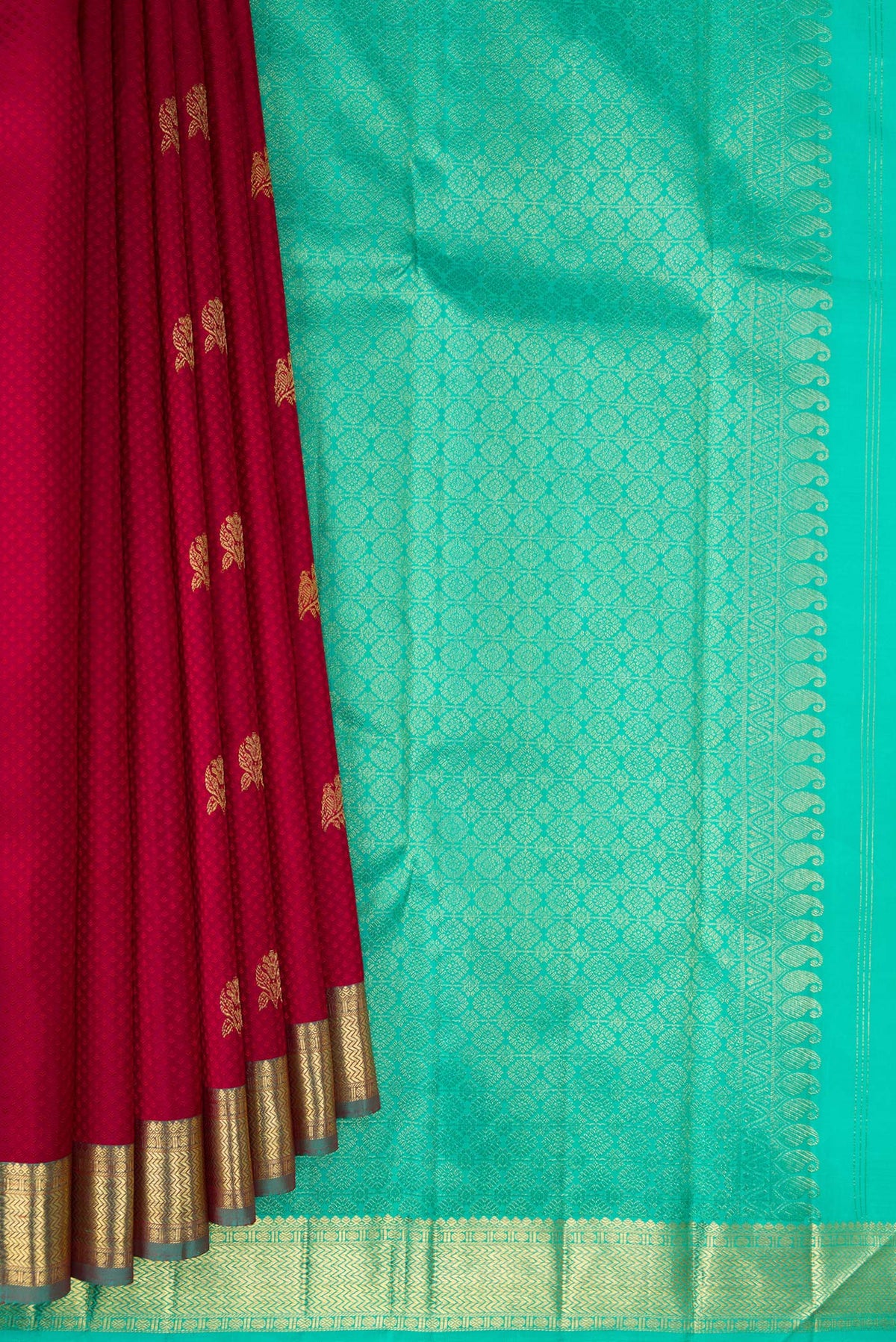 Pleats and pallu of Pure Silk Deep Red Kanchipuram Saree with Jacquard With Zari Butta on the body and Zari Border. 