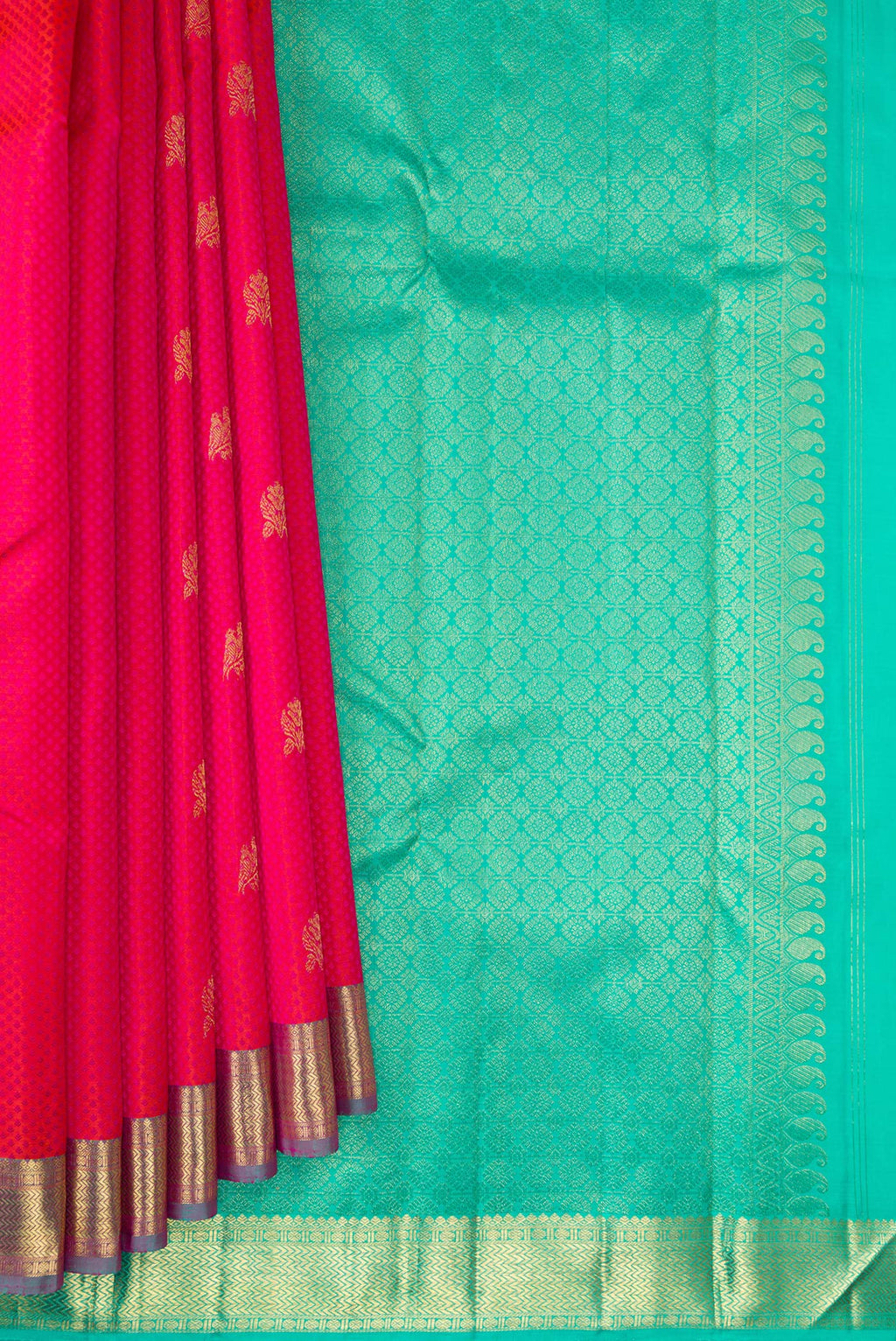Pleats and pallu of Pure Silk Coral Kanchipuram Saree with Jacquard With Zari Butta on the body and Zari Border. 
