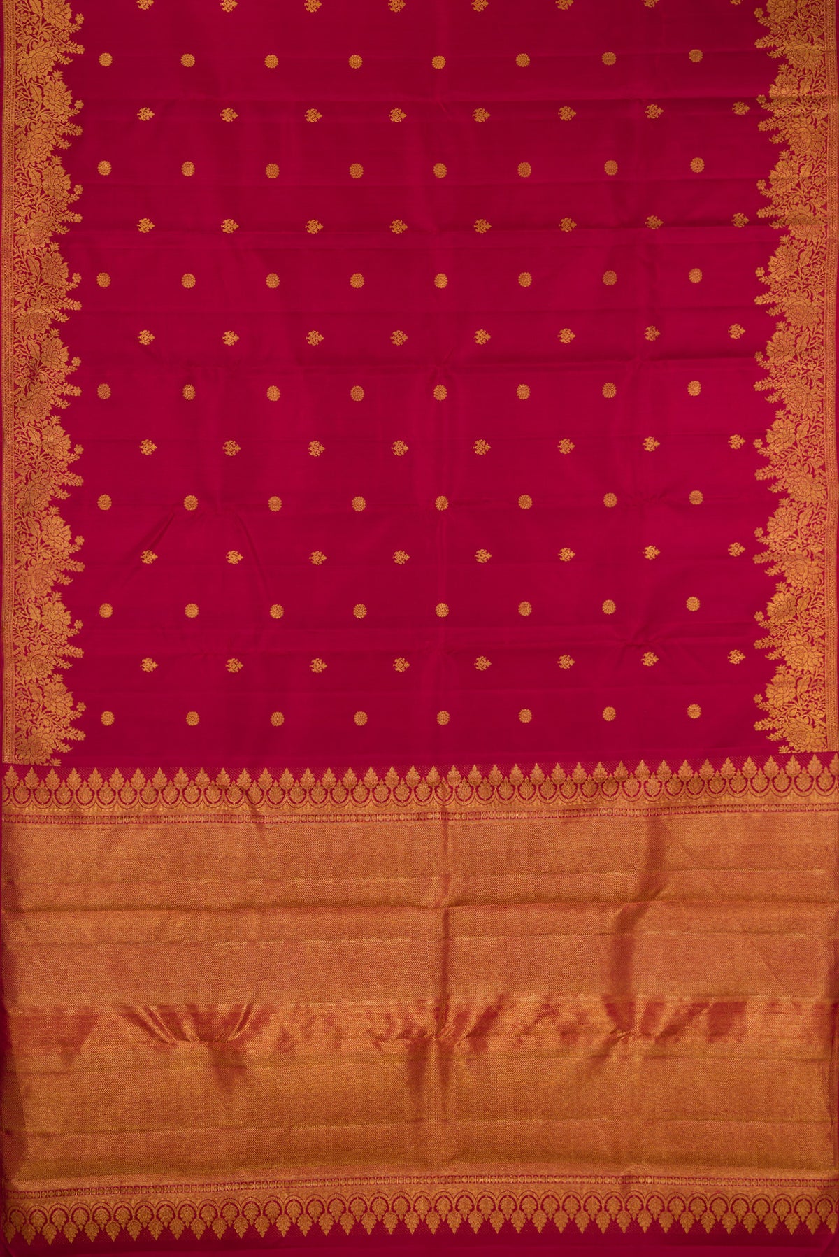 Flat view of Pure Silk Maroon Kanjivaram Saree with Zari Butta on the body and Fancy Border. 