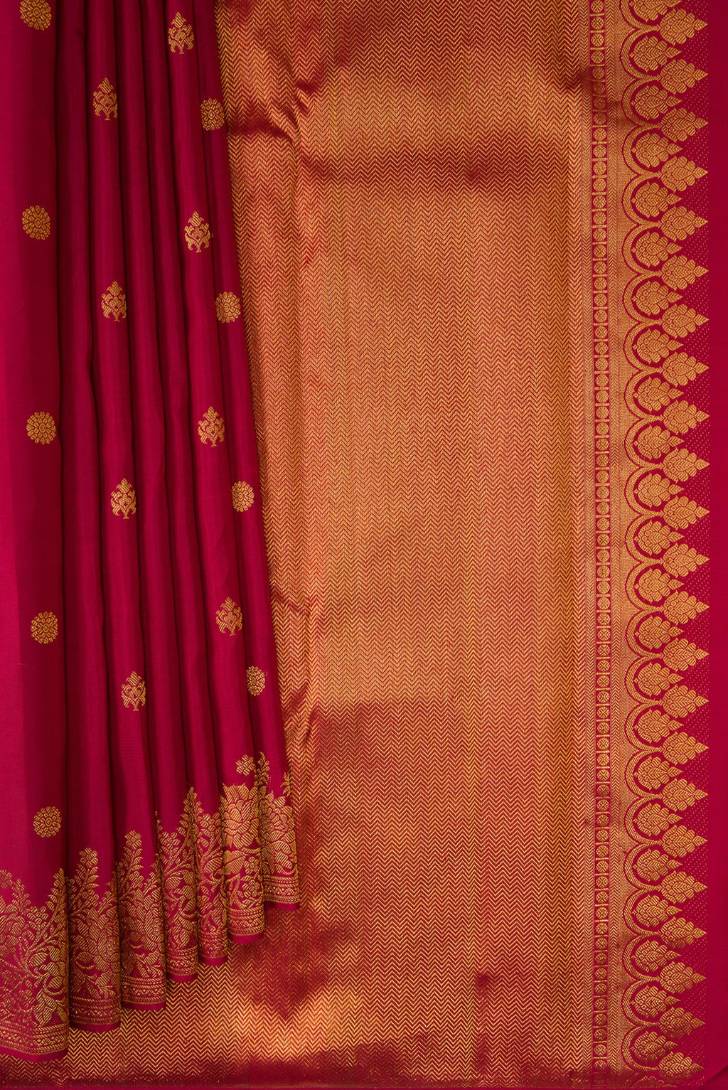 Pleats and pallu of Pure Silk Maroon Kanjivaram Saree with Zari Butta on the body and Fancy Border. 