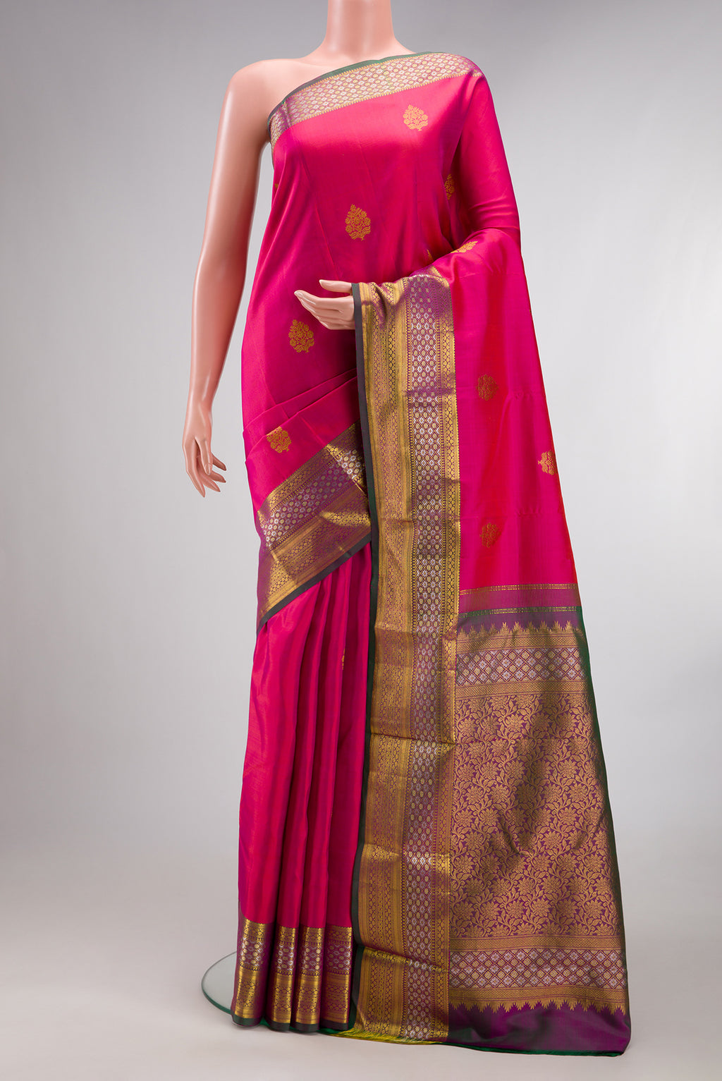 Pure Silk Dark Pink Dual Tone Kanjivaram Saree with Zari Butta on the body and Zari Border.  displayed on a mannequin
