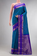 Pure Silk Peacock Blue Dual Tone Kanjivaram Saree with Stripes on the body and Zari Border.  displayed on a mannequin