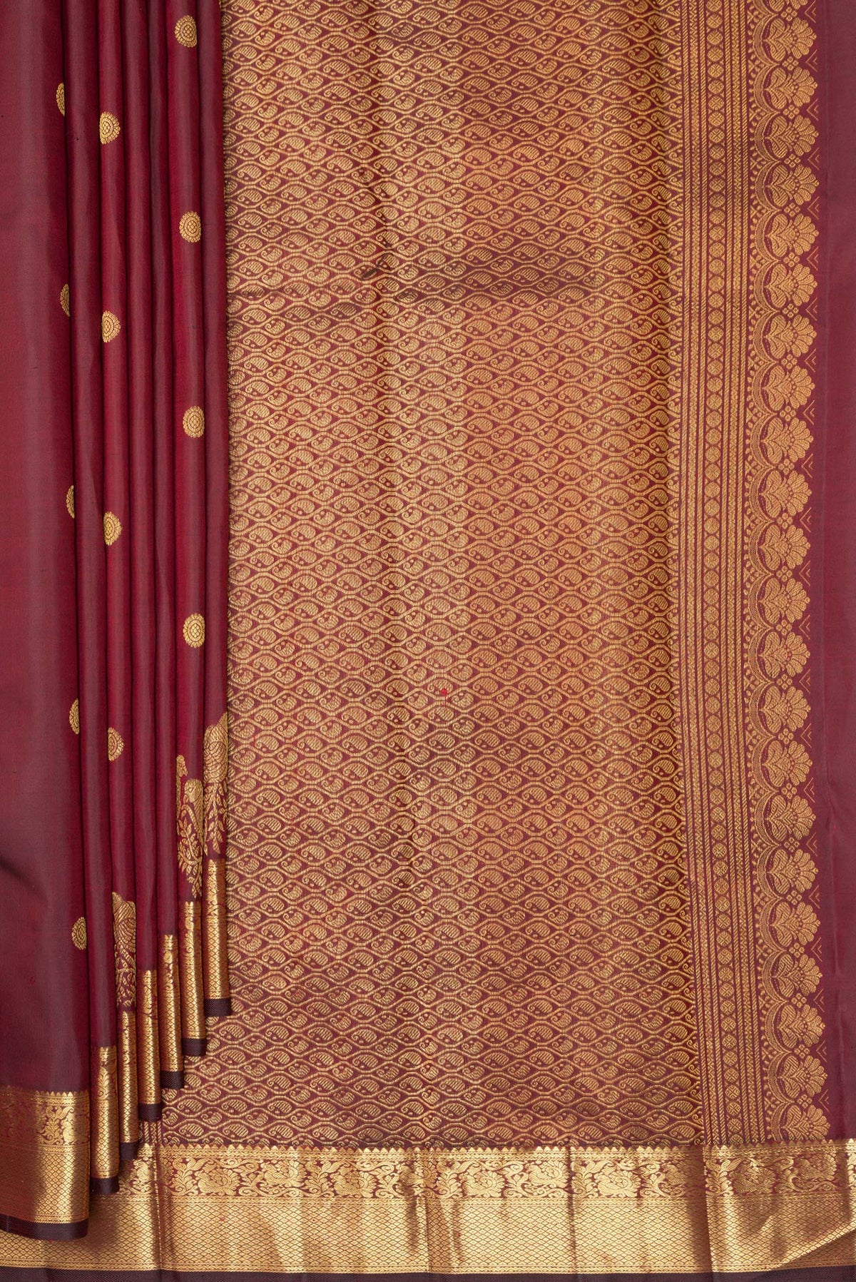 Pleats and pallu of Pure Silk Maroon Kanjivaram Saree with Zari Butta on the body and Zari Border. 