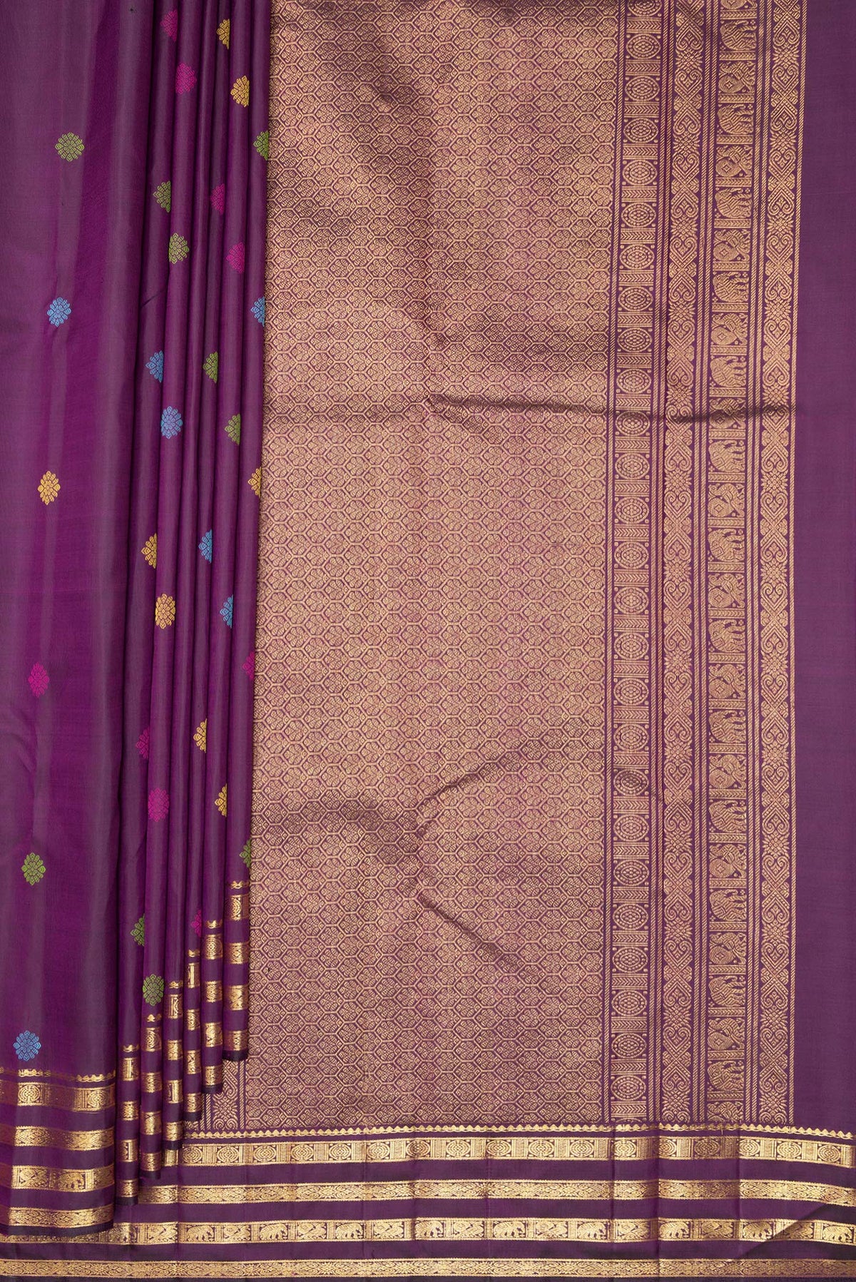 Pleats and pallu of Pure Silk Purple Kanchipuram Saree with Thread Butta on the body and Zari Border. 