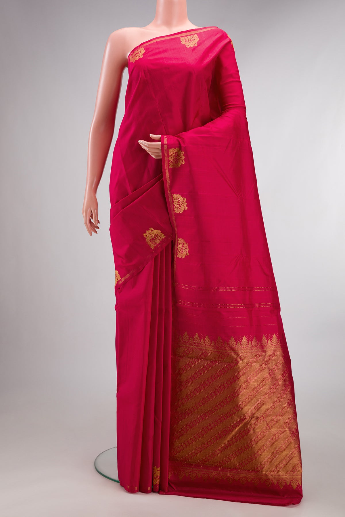 Pure Silk Dark Pink Dual Tone Kanchipuram Saree with Plain Body and Fancy Border.  displayed on a mannequin