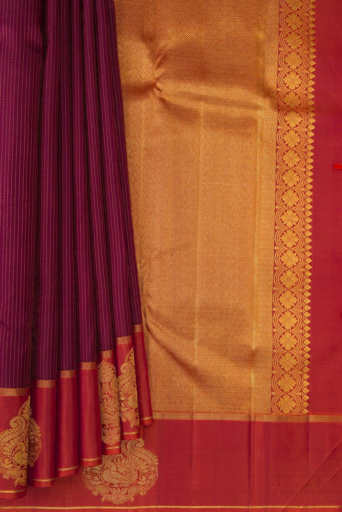 Pleats and pallu of Pure Silk Maroon Kanchipuram Saree with Stripes on the body and Fancy Border. 