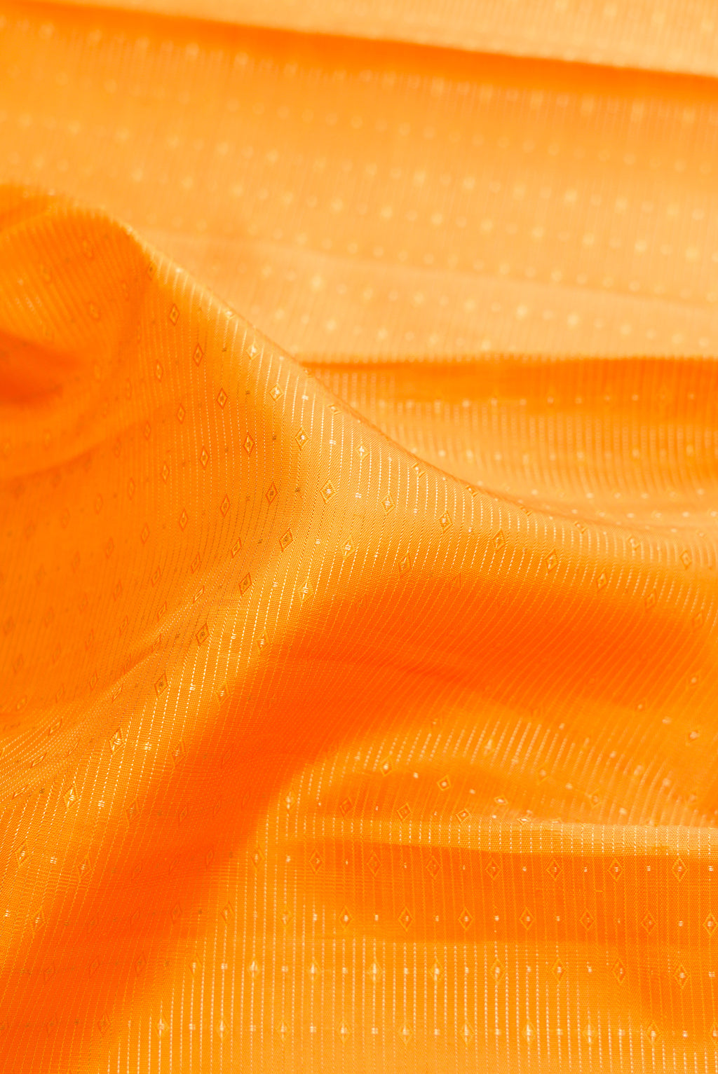 Close up of Pure Silk Mustard Kanjivaram Saree with Stripes on the body and Zari Border.  displaying folds