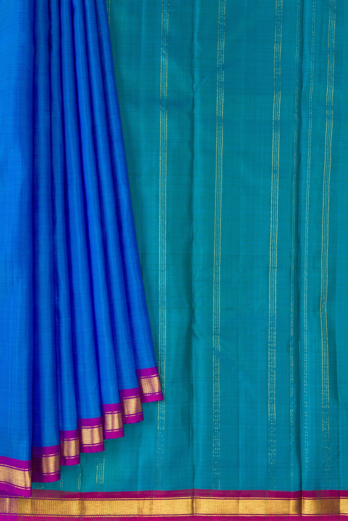 Pleats and pallu of Pure Silk Royal Blue Kanchipuram Saree with Plain Body and Zari Border. 