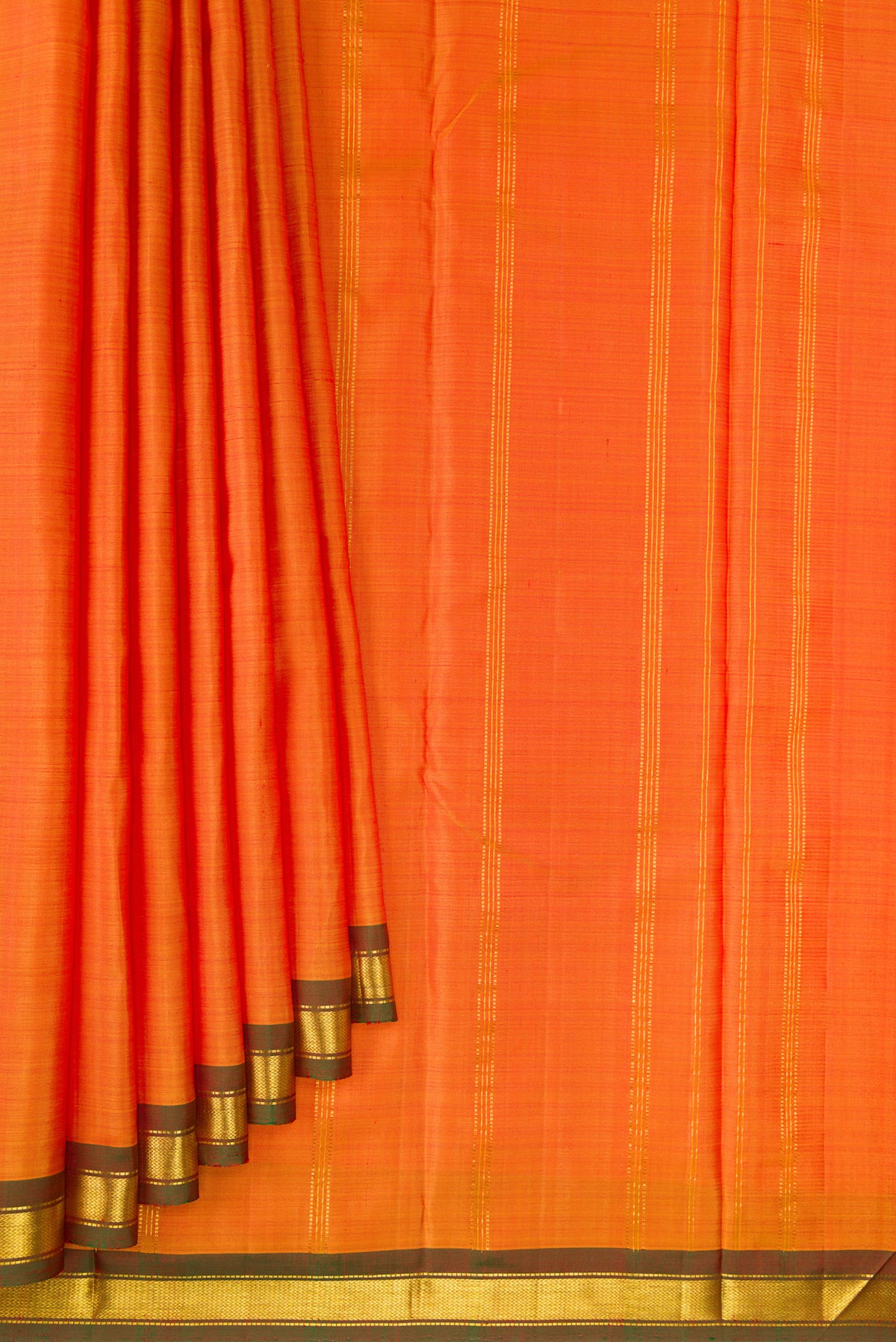 Pleats and pallu of Pure Silk Orange Dual Tone Kanchipuram Saree with Plain Body and Zari Border. 