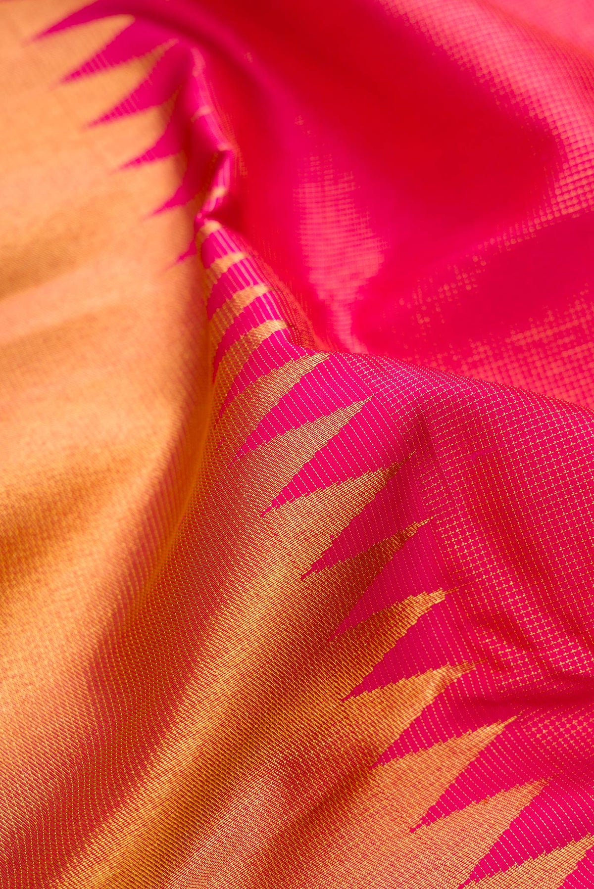 Close up of Pure Silk Pink Kanchipuram Saree with Half And Half on the body and Without Border.  displaying folds