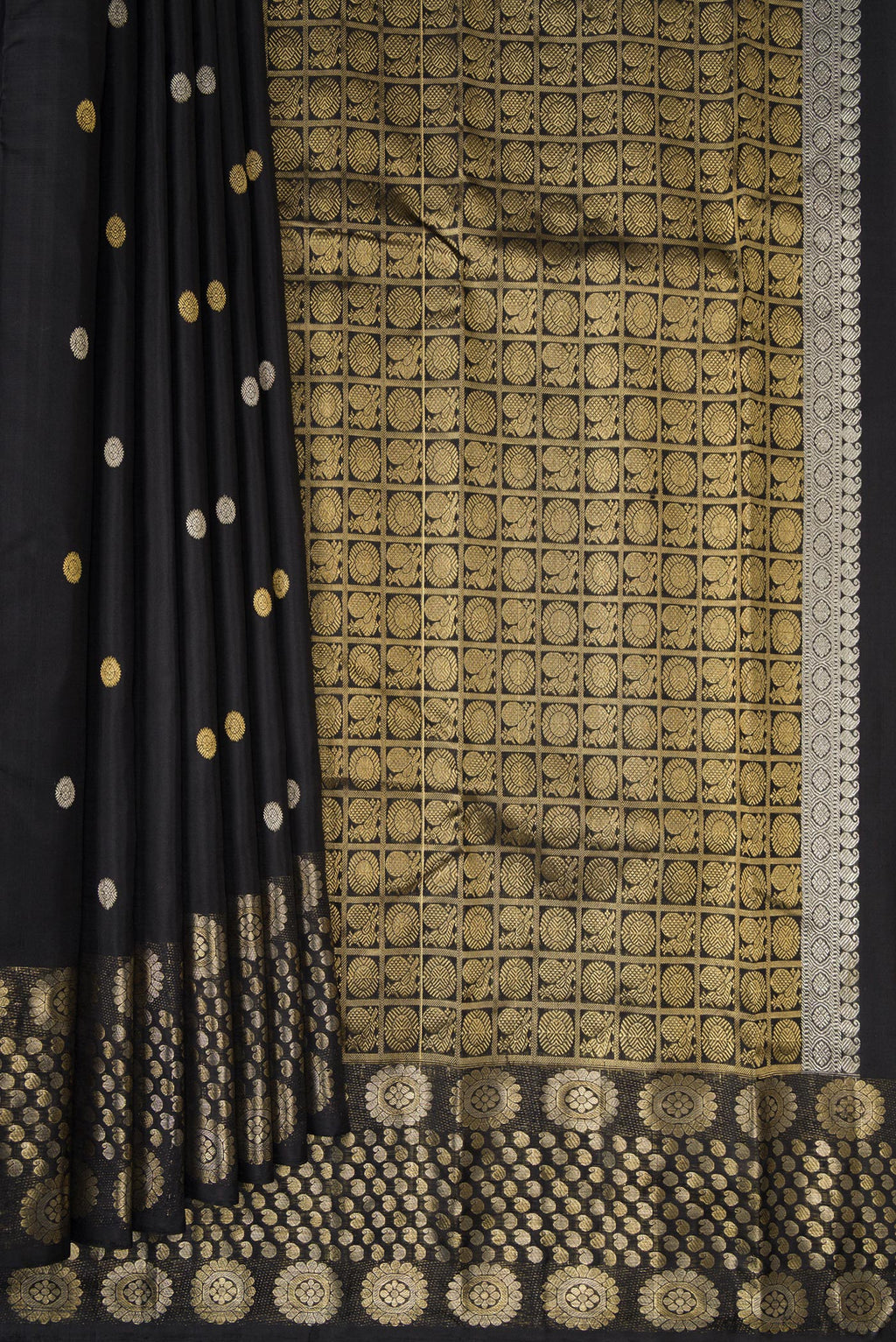 Pleats and pallu of Pure Silk Black Kanjivaram Saree with Zari Butta on the body and Fancy Border. 