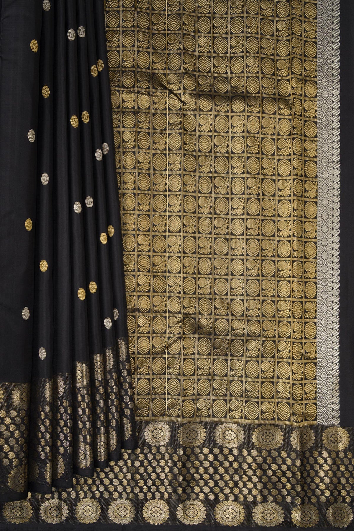 Pleats and pallu of Pure Silk Black Kanjivaram Saree with Zari Butta on the body and Fancy Border. 