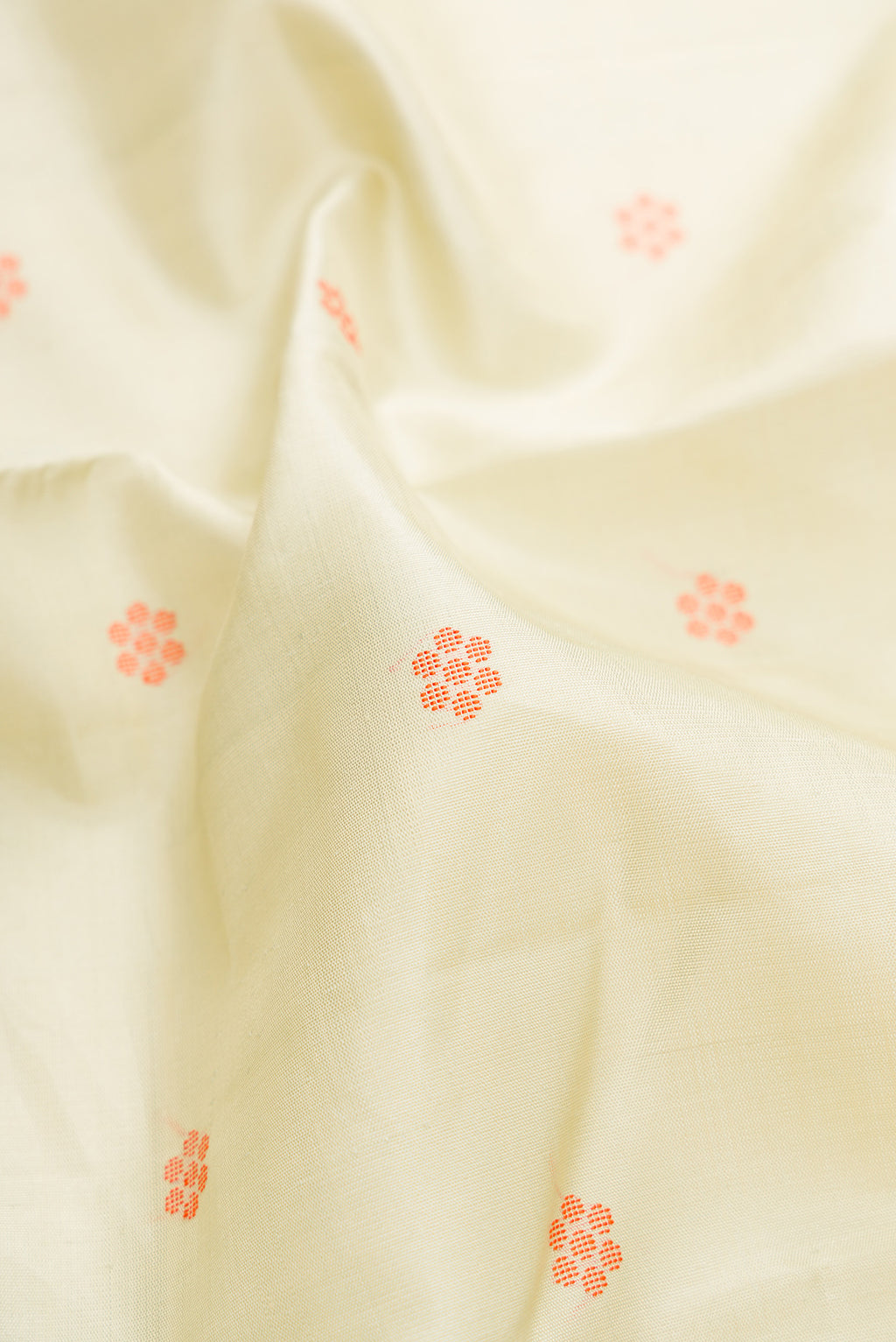 Close up of Pure Silk Pista Green Kanjivaram Saree with Thread Butta on the body and Zari Border.  displaying folds