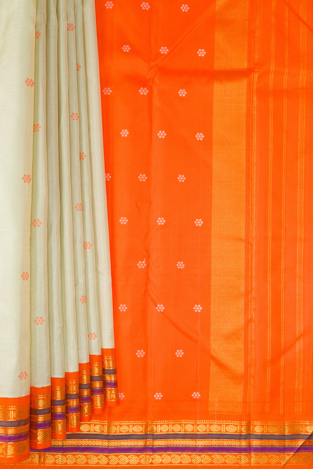 Pleats and pallu of Pure Silk Pista Green Kanjivaram Saree with Thread Butta on the body and Zari Border. 