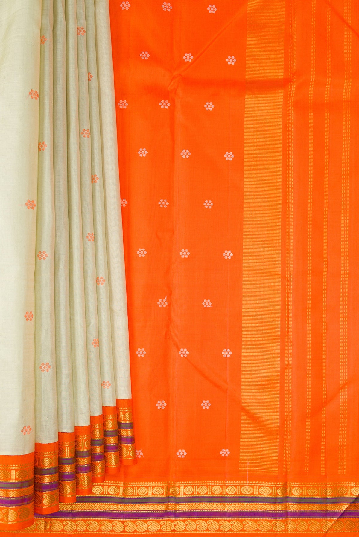 Pleats and pallu of Pure Silk Pista Green Kanjivaram Saree with Thread Butta on the body and Zari Border. 