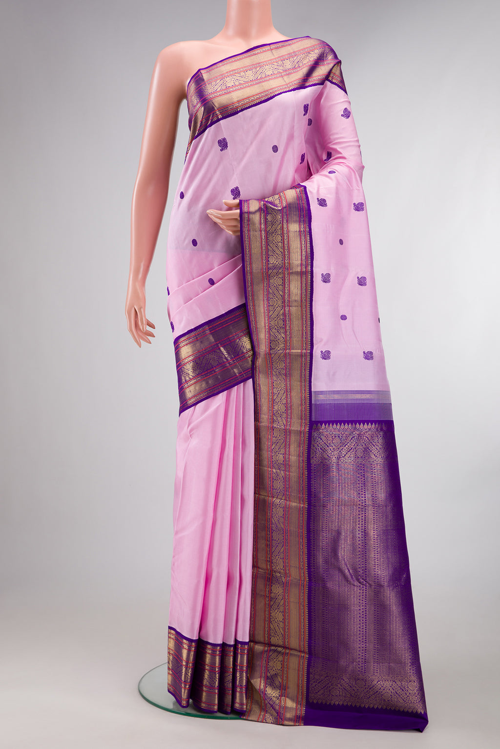 Pure Silk Pure Zari Pink Dual Tone Kanjivaram Saree with Thread Butta on the body and Zari Border.  displayed on a mannequin