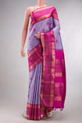 Pure Silk Lavender Kanjivaram Saree with Thread Butta on the body and Zari Border.  displayed on a mannequin