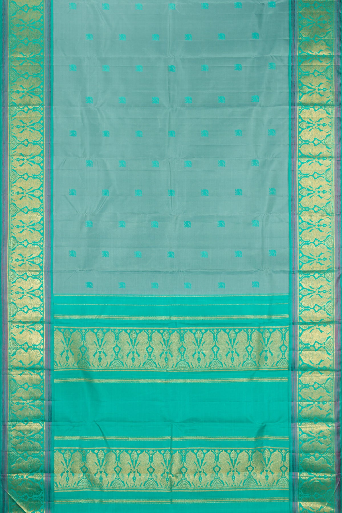 Flat view of Pure Silk Turquoise Dual Tone Kanjivaram Saree with Thread Butta on the body and Fancy Border. 