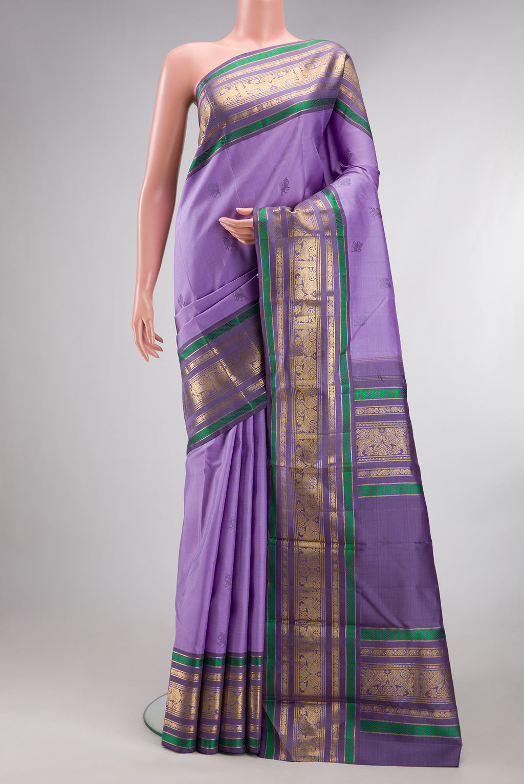 Pure Silk Pure Zari Lavender Dual Tone Kanjivaram Saree with Thread Butta on the body and Zari Border.  displayed on a mannequin