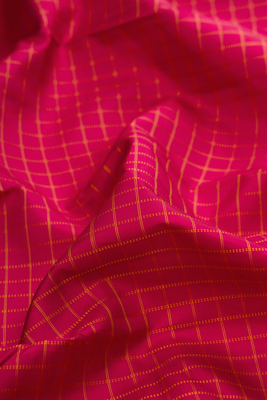 Close up of Pure Silk Maroon Kanchipuram Saree with Checked design on the body and Fancy Border.  displaying folds