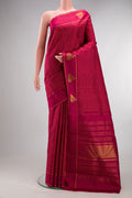 Pure Silk Maroon Kanchipuram Saree with Checked design on the body and Fancy Border.  displayed on a mannequin