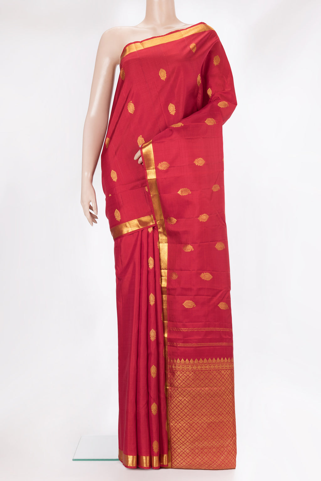 Pure Silk Red Kanchipuram Saree with Zari Butta on the body and Zari Border.  displayed on a mannequin