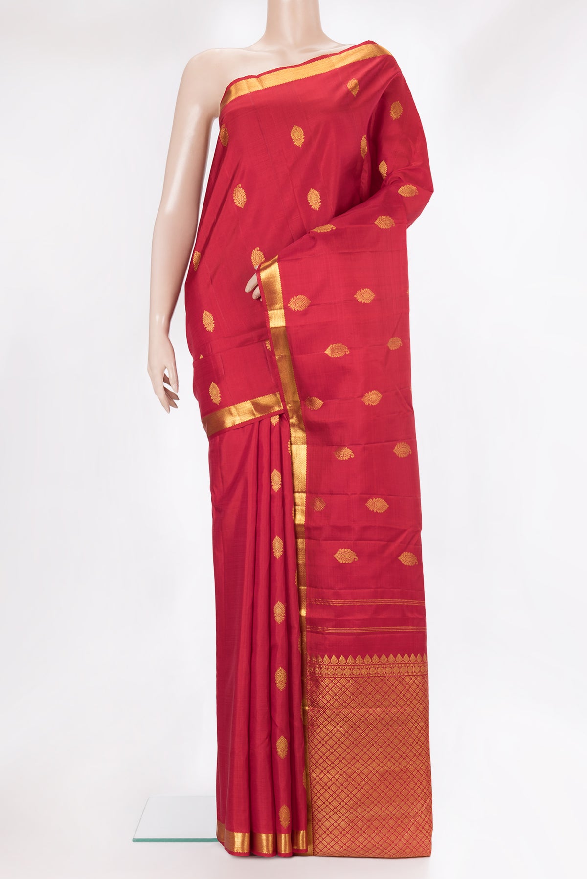 Pure Silk Red Kanchipuram Saree with Zari Butta on the body and Zari Border.  displayed on a mannequin