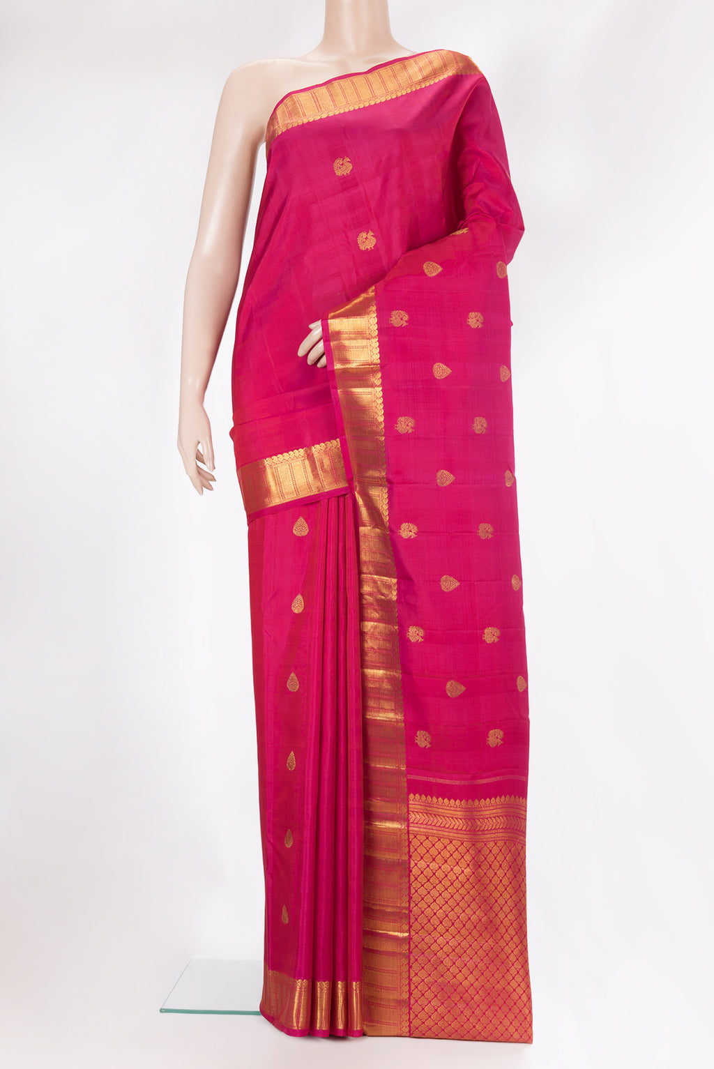 Pure Silk Dark Pink Kanjivaram Saree with Zari Butta on the body and Zari Border.  displayed on a mannequin