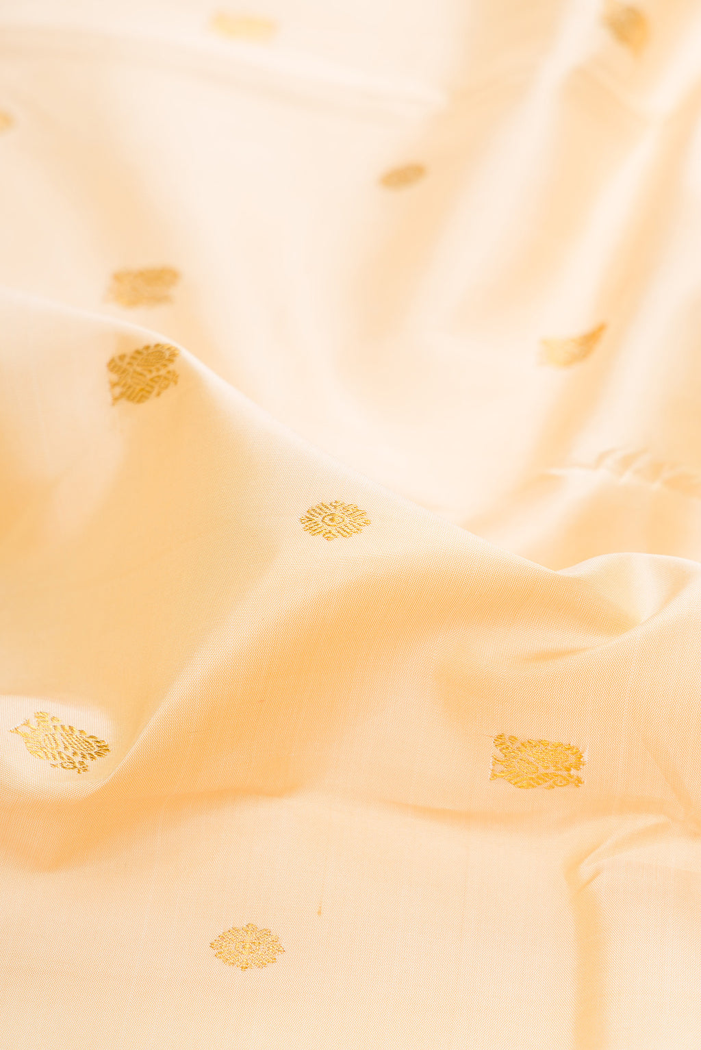 Close up of Pure Silk Sandal Kanjivaram Saree with Zari Butta on the body and Ganga Jamuna Border.  displaying folds