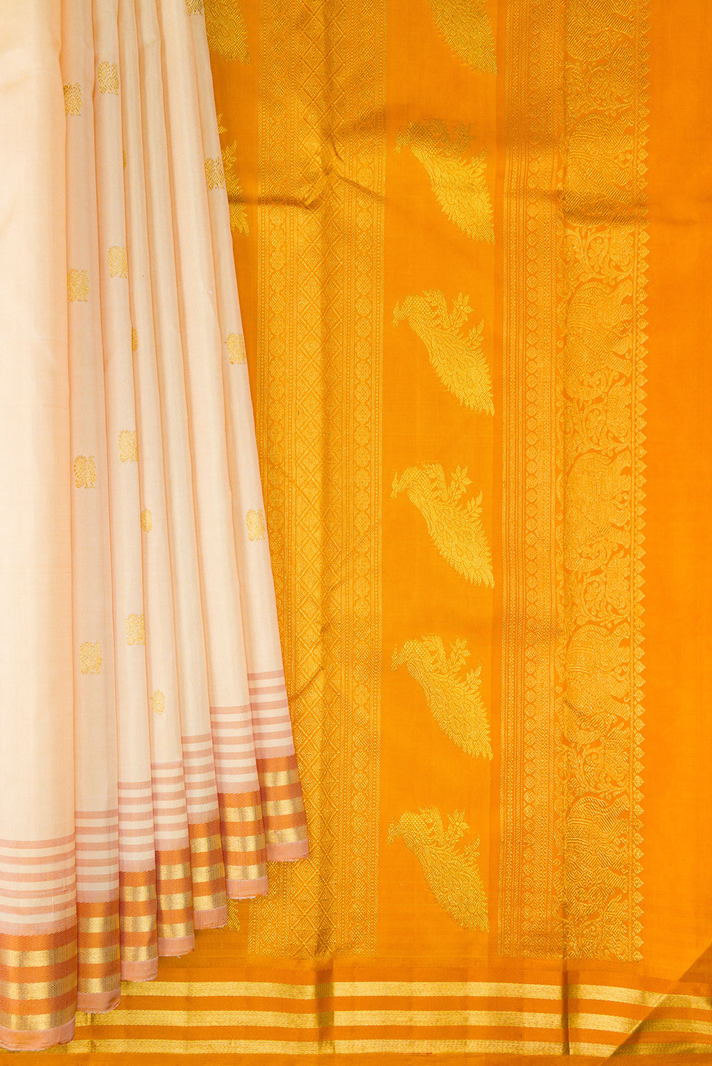 Pleats and pallu of Pure Silk Sandal Kanjivaram Saree with Zari Butta on the body and Ganga Jamuna Border. 